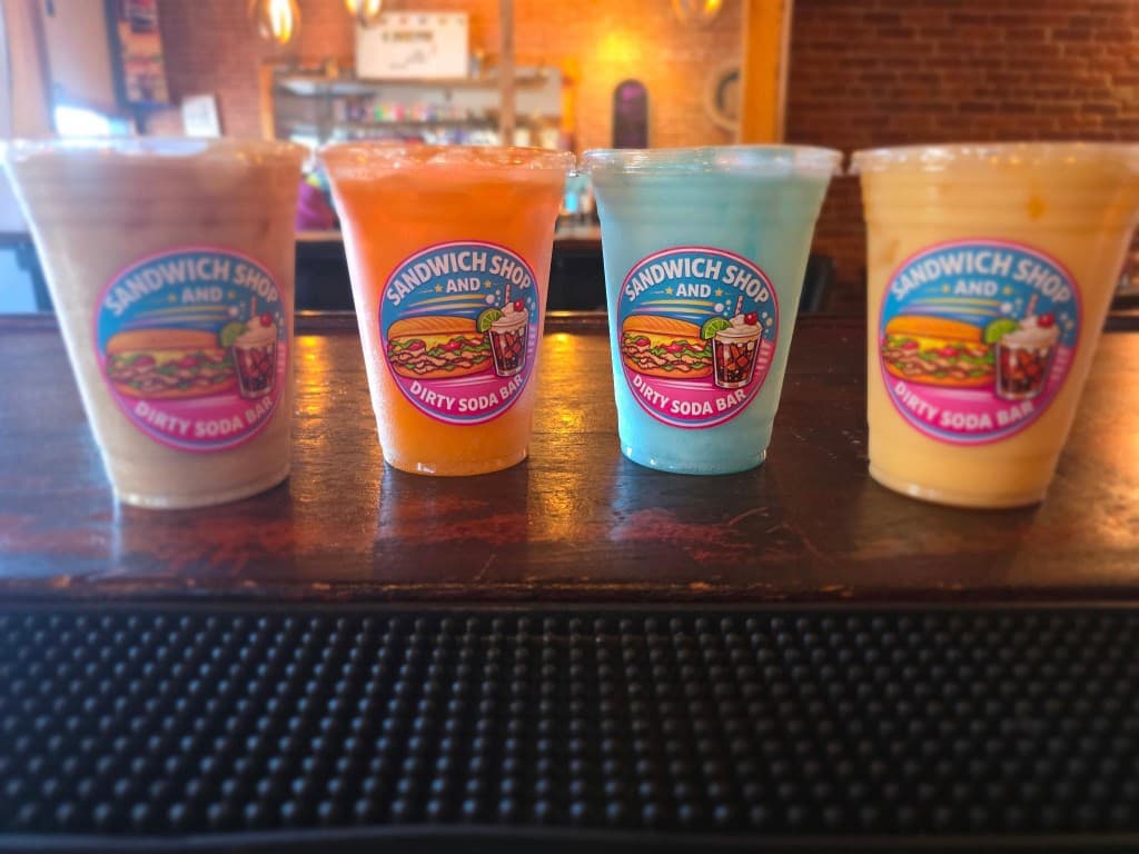 Colorful dirty sodas lined up at the bar